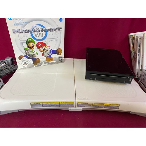 611 - Black Nintendo Wii console with controllers, Mariokart bundle, fit board and 9 games