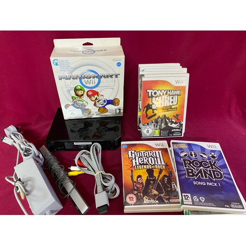 611 - Black Nintendo Wii console with controllers, Mariokart bundle, fit board and 9 games