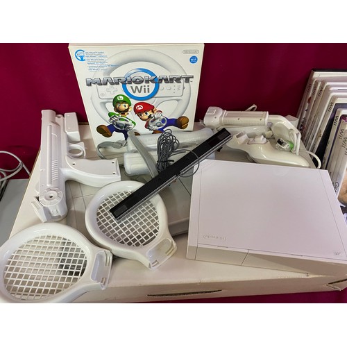 612 - White Nintendo Wii console with controllers, Mariokart bundle, fit board and 10 games