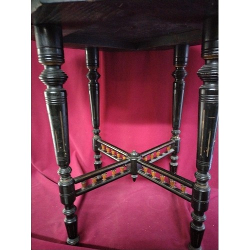 884 - Victorian ebonised hexagonal side table measuring 55 cms diameter and 58 cms tall