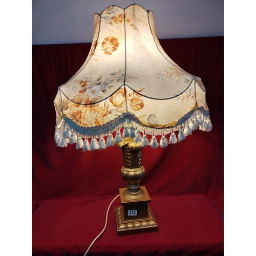 876 - Large wooden carved in gold table lamp with shade  measuring 86 cms tall, fully working