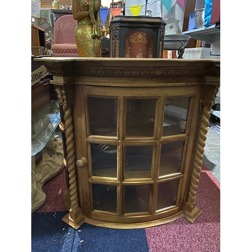 154 - Light wood display cabinet with glass front and 2 shelves, single opening door. Wall hanging or sit ... 