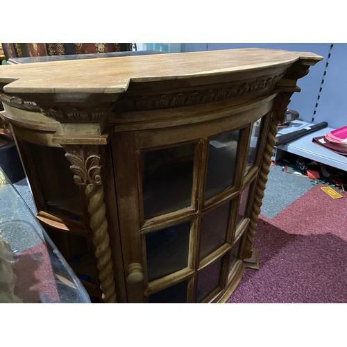 154 - Light wood display cabinet with glass front and 2 shelves, single opening door. Wall hanging or sit ... 