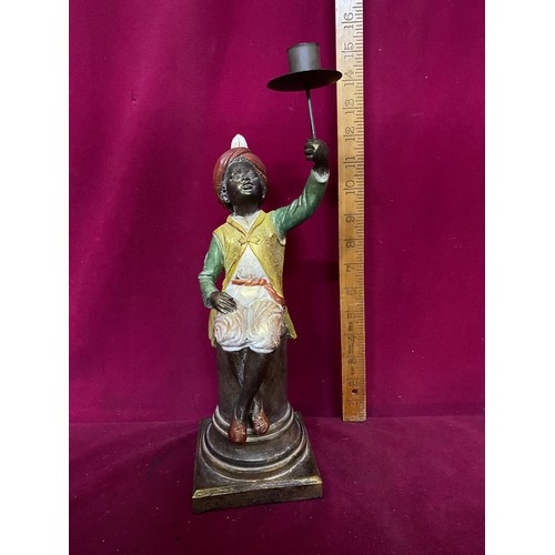 156 - Candle holder held by boy sat on column. 36cms