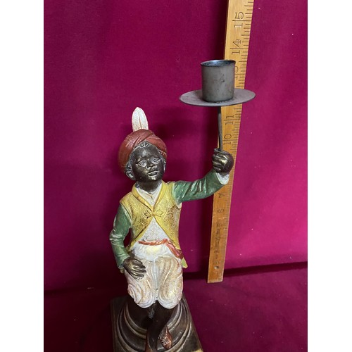 156 - Candle holder held by boy sat on column. 36cms