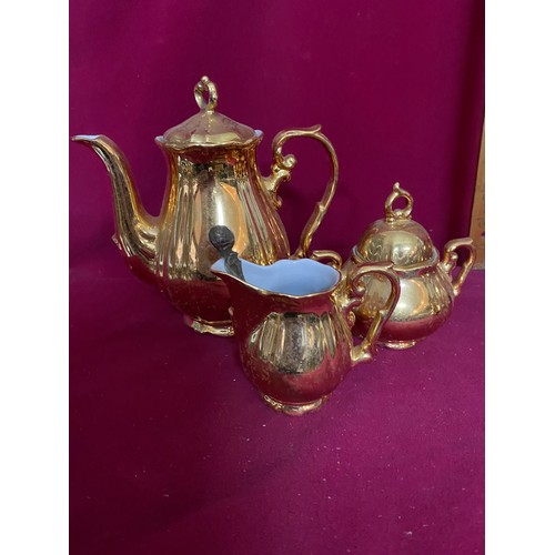 158 - Gold and white coffee set comprising of 12 cups and saucers, coffee pot, milk and sugar bowl.