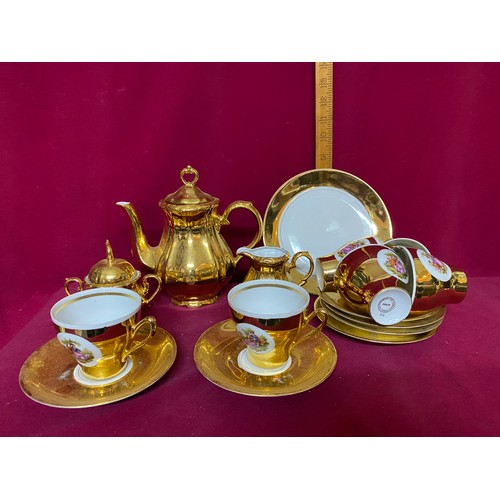 159 - Gold and white coffee set comprising of 6 cups and saucers, coffee pot, 2 plates,milk and sugar bowl