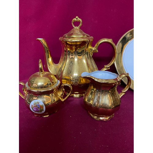 159 - Gold and white coffee set comprising of 6 cups and saucers, coffee pot, 2 plates,milk and sugar bowl