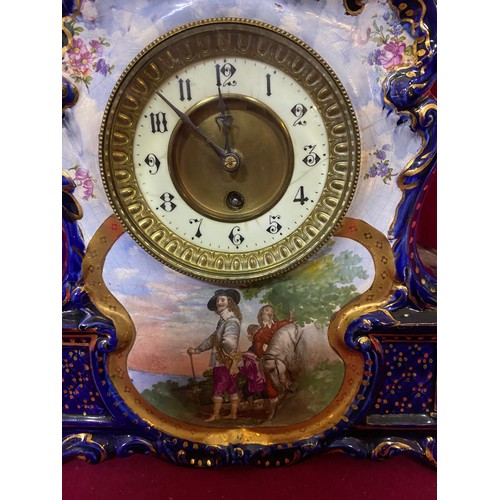 19 - Decorative hand painted mantle clock with key