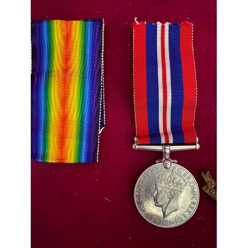 47 - Original WW2 full size medal with ribbon, Loyal Regiment cap Badge and others.