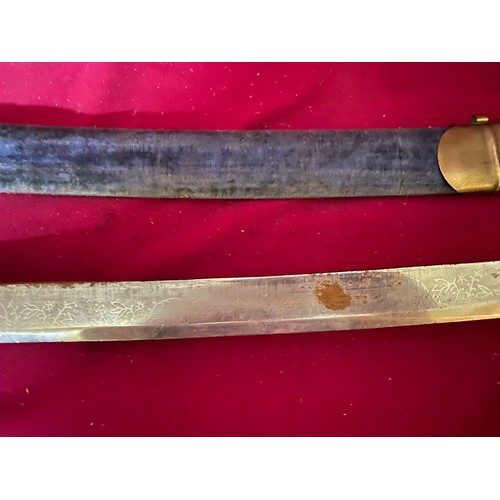 53 - Decorative brass handled sword in sheath