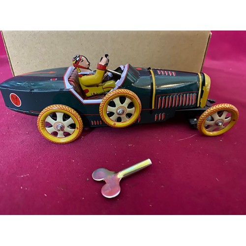 54 - Clockwork tin plate Bugatti racing car in box.