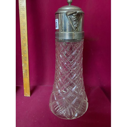 430 - Cut glass beverage decanter with silver plate flip top