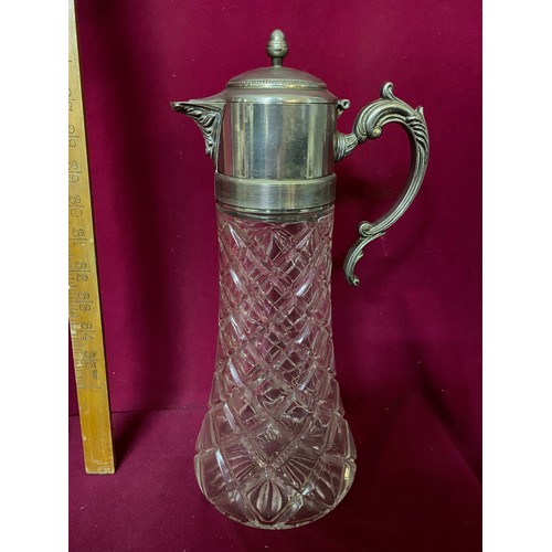 430 - Cut glass beverage decanter with silver plate flip top