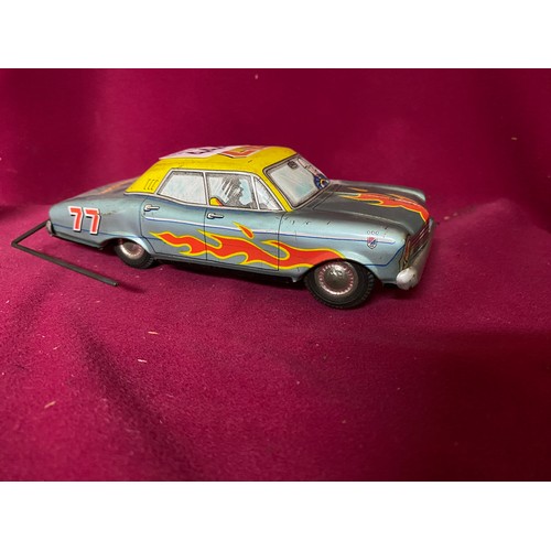 444 - 1950's vintage tin litho Mikuni wind-up roll-over stunt car, working