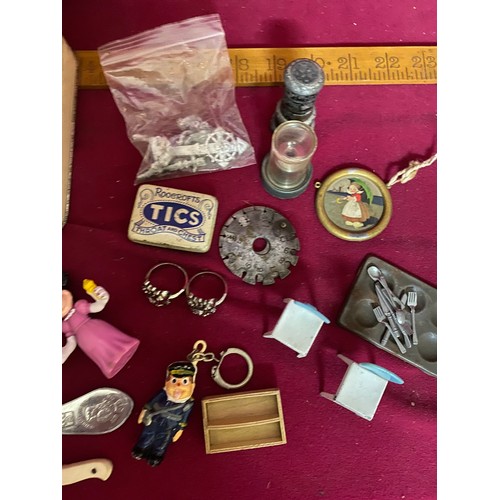 49 - Assortment of curios in tin box.