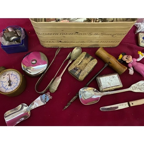 49 - Assortment of curios in tin box.