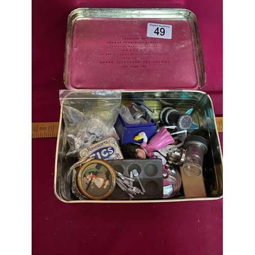 49 - Assortment of curios in tin box.