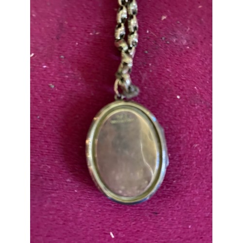 449 - Locket and chain marked 9CT gold front and back on locket only and weighing 13.3 g in total