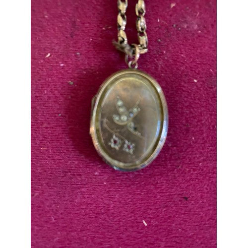 449 - Locket and chain marked 9CT gold front and back on locket only and weighing 13.3 g in total