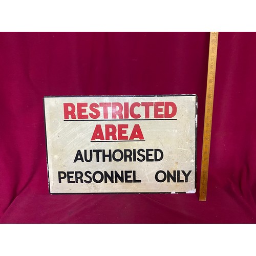 104 - Vintage metal sign measuring 61 x 40 cms 'Restricted area authorised personnel only'