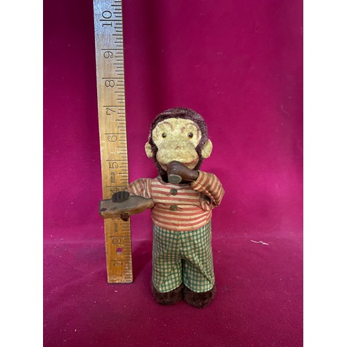 118 - Vintage Japanese monkey wind up tin toy, fully working drinking and his tail spins