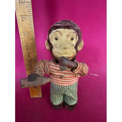 118 - Vintage Japanese monkey wind up tin toy, fully working drinking and his tail spins