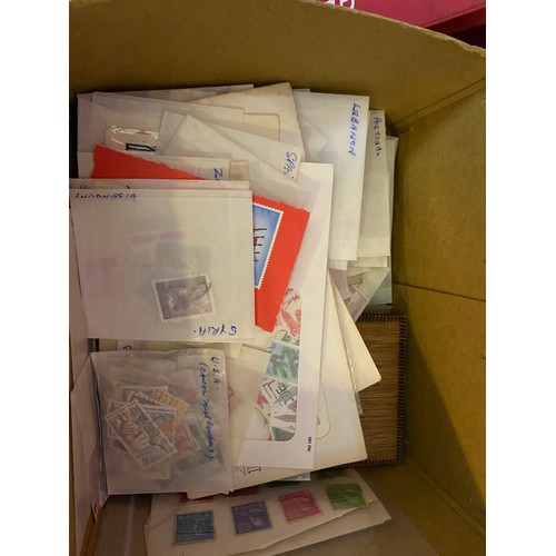 26 - Box filled with stamps and First Day Covers.