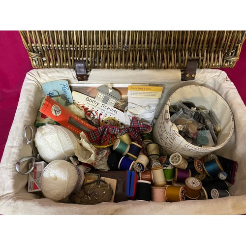 184 - Wicker sewing basket filled with buttons and cottons