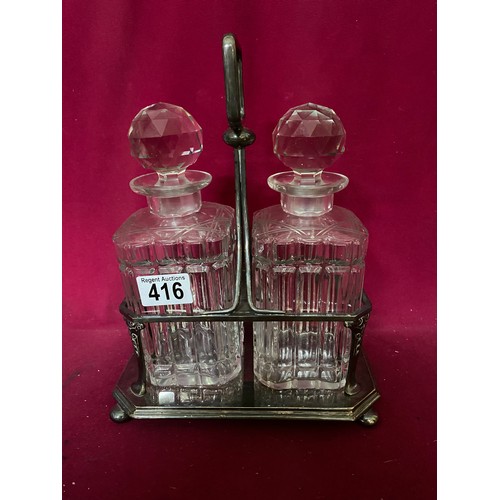 416 - Pair of glass decanters in silver plated display tray