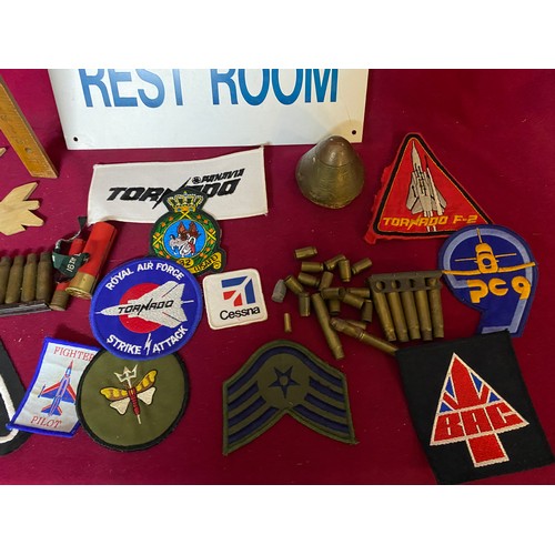 46 - Box of Militaria including Aircrew sign, patches and spent cartridges.