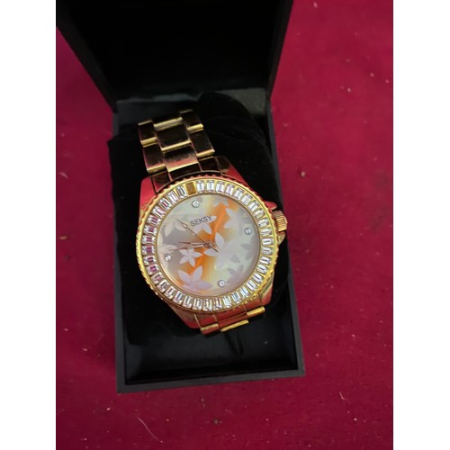 65 - Boxed Seksy watch in gold tone