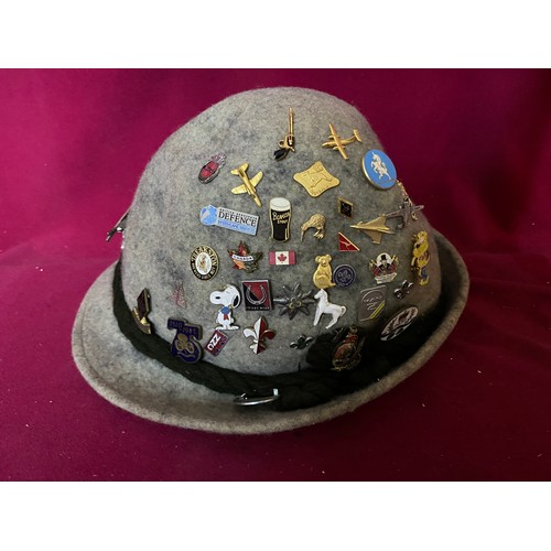 87 - Alpine hat with badges and ice stick.