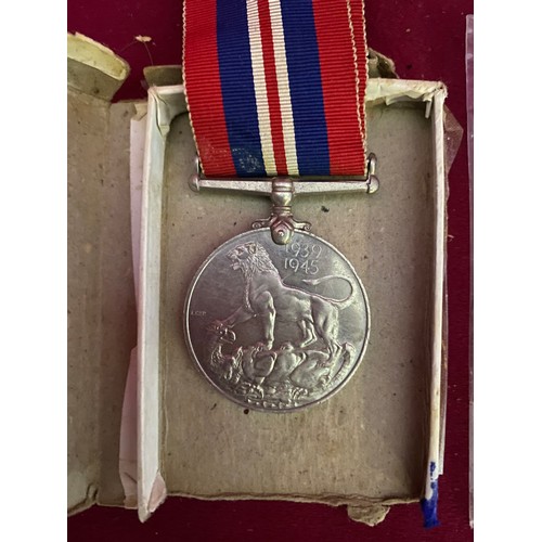 90 - Original WW2 medal and large Armistice coin.