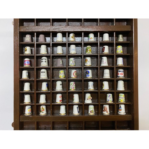 155 - Large thimble rack with selection of assorted thimbles. 83 x 37cms