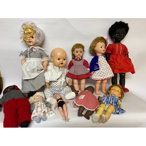 163 - Assortment of vintage dolls of various sizes.