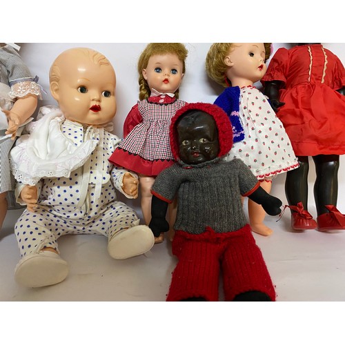 163 - Assortment of vintage dolls of various sizes.