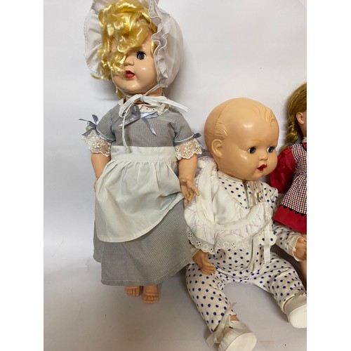 163 - Assortment of vintage dolls of various sizes.