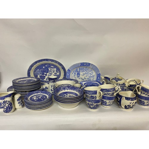 164 - Large selection of blue and white plates, side plates, bowls, cups, saucers, teapot and gravy boat.