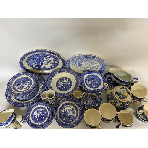 164 - Large selection of blue and white plates, side plates, bowls, cups, saucers, teapot and gravy boat.