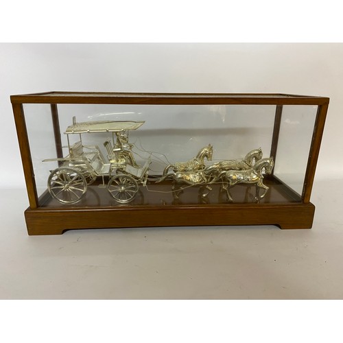 170 - Horse and carriage in Indian Silver set in glass display case. 41x19x13cms