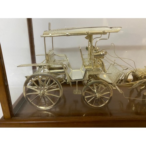 170 - Horse and carriage in Indian Silver set in glass display case. 41x19x13cms