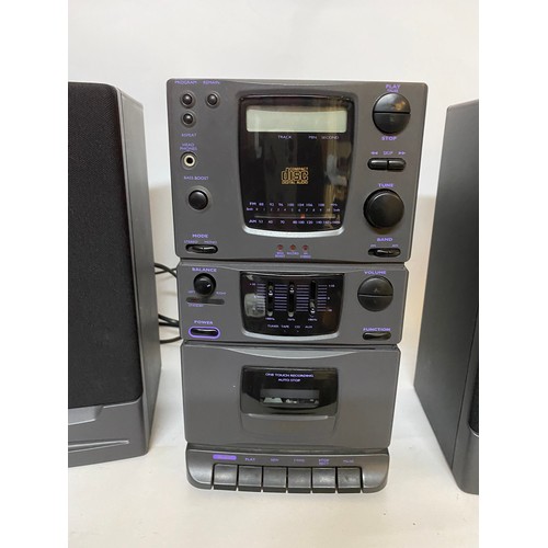 174 - Compact disc and cassette player with 2 speakers, powers up.