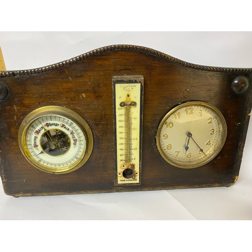 210 - 2 x freestanding Barometers set in wooden frames, both include thermometer and one also has clock .