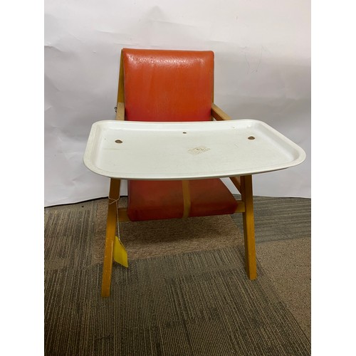 221 - Mid century child’s chair with food tray in red vinyl seat and pine legs.