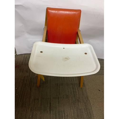 221 - Mid century child’s chair with food tray in red vinyl seat and pine legs.