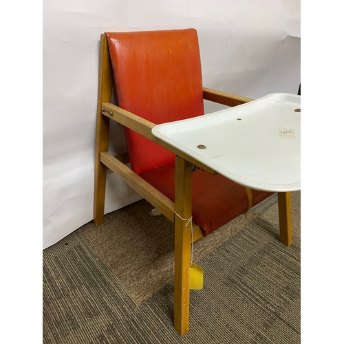 221 - Mid century child’s chair with food tray in red vinyl seat and pine legs.