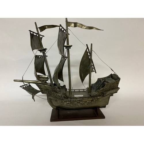 209 - Pewter Galleon on wooden base 45x43cms.