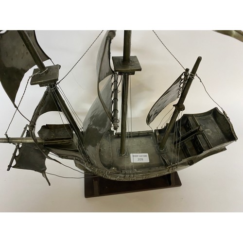 209 - Pewter Galleon on wooden base 45x43cms.