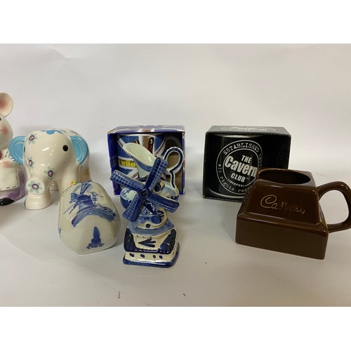 241 - Selection of pottery including money boxes, Delft and advertising mugs